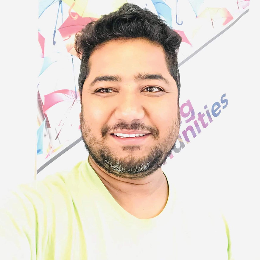 Man olive skin dark hear wearing yellow shirt