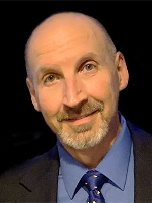 Bald older man wearing a suit