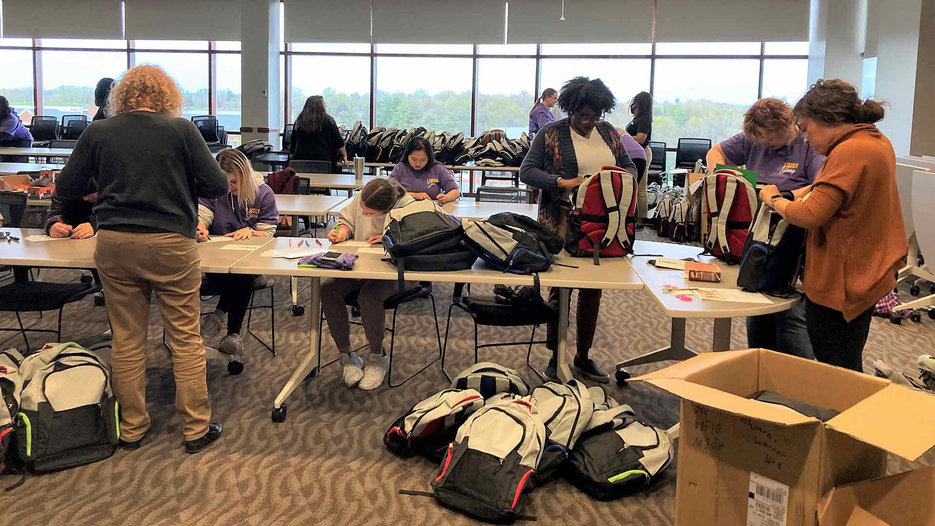 Students packing backpacks at LindenGiving event