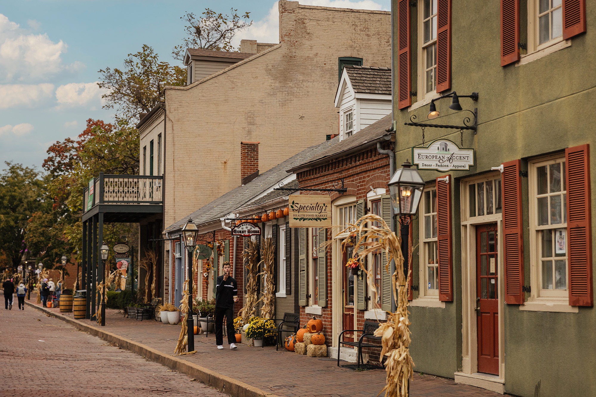 Photo of student walking in front of shops at Historic Main Street in St. Charles