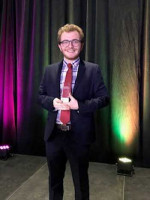 Matt Stocker displays his team's Gold ADDY Award at the recent St. Louis ADDY Award ceremony.