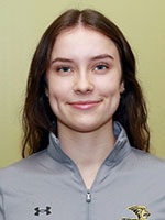 Girl with dark brown hair and blue eyes smiling wearing Lindenwood Athletic sweatshirt