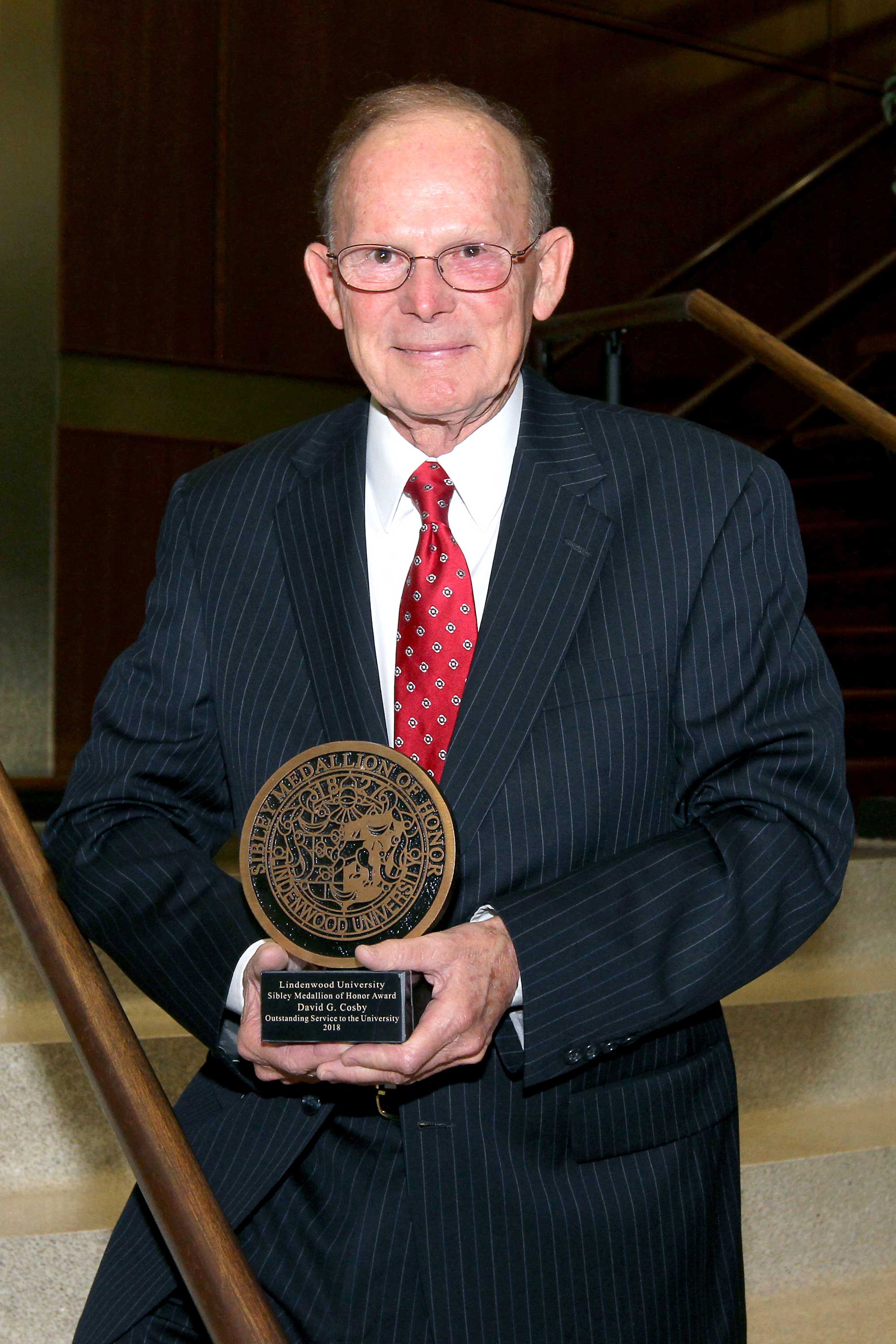 David G. Cosby with award