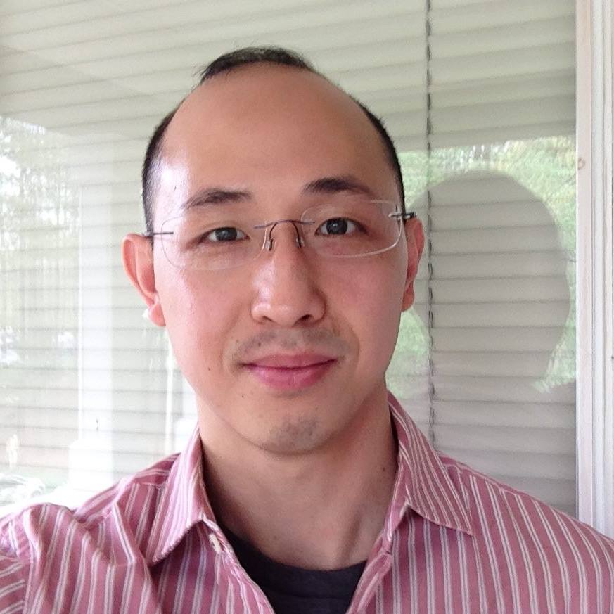 Man with glasses striped shirt dark hair