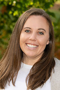 White woman with brown hair and blue eyes