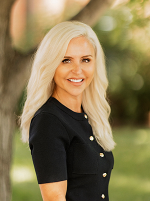 White Woman, platinum blonde shoulder legnth hair and brown eyes