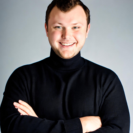 White man brown hair wearing a black turtle neck